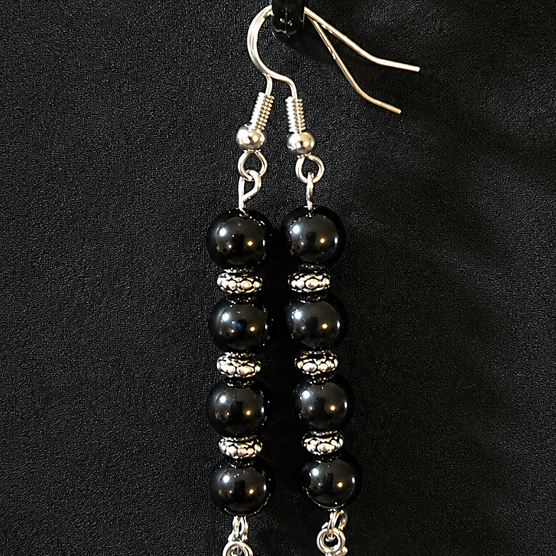 Silver plated star fish ear ring set with black glass beads